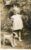 Young Girl Child with stuffed toy dog vintage photo postcard